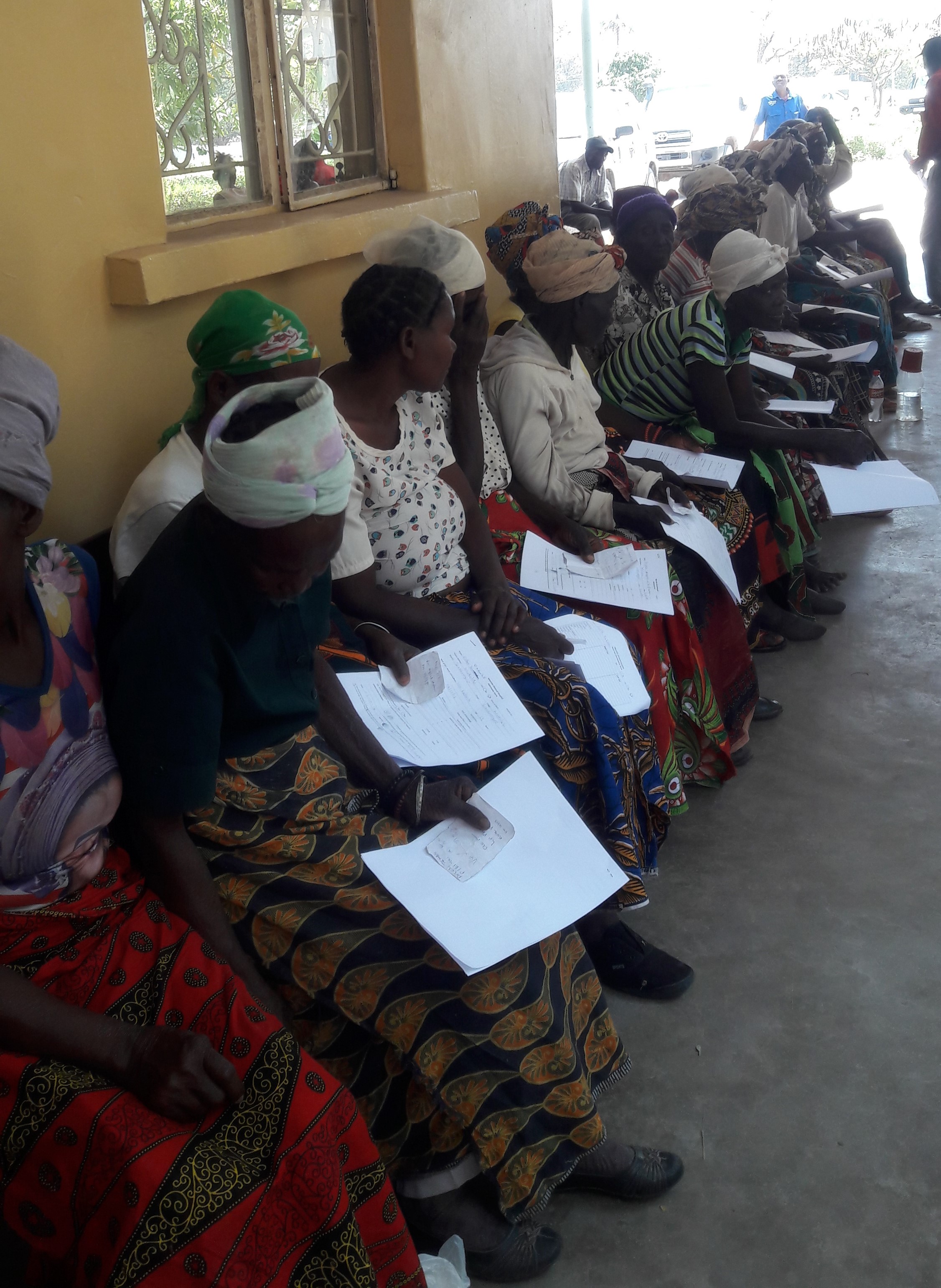 Women in Zambia lining up to have their eyes screened at an Operation Eyesight screening and outreach program.