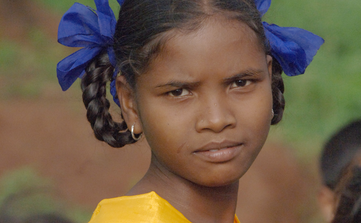Young girl with blue bows in her hair