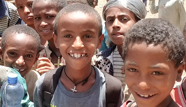 Group of young boys smiling, in Ethiopia.