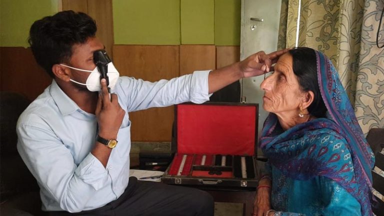A senior woman gets her eyes checked