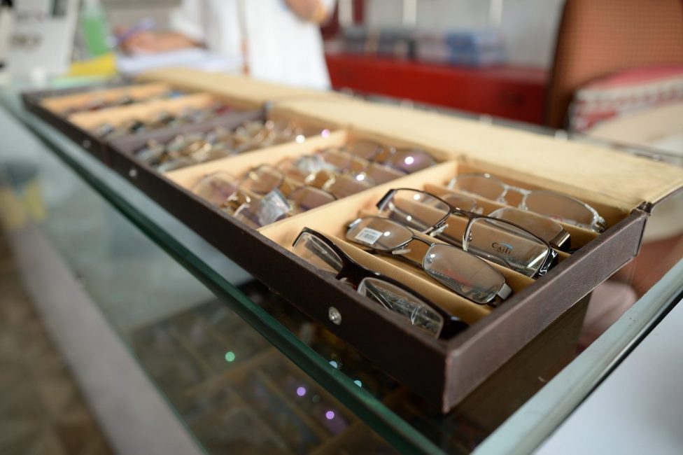 Eyeglasses arranged neatly in a box