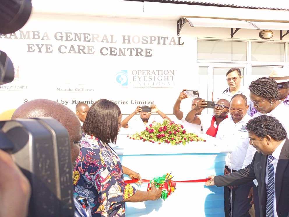 Operation Eyesight staff and dignitaries cut the ribbon for the official opening of the Eye Unit at Maamba General Hospital.