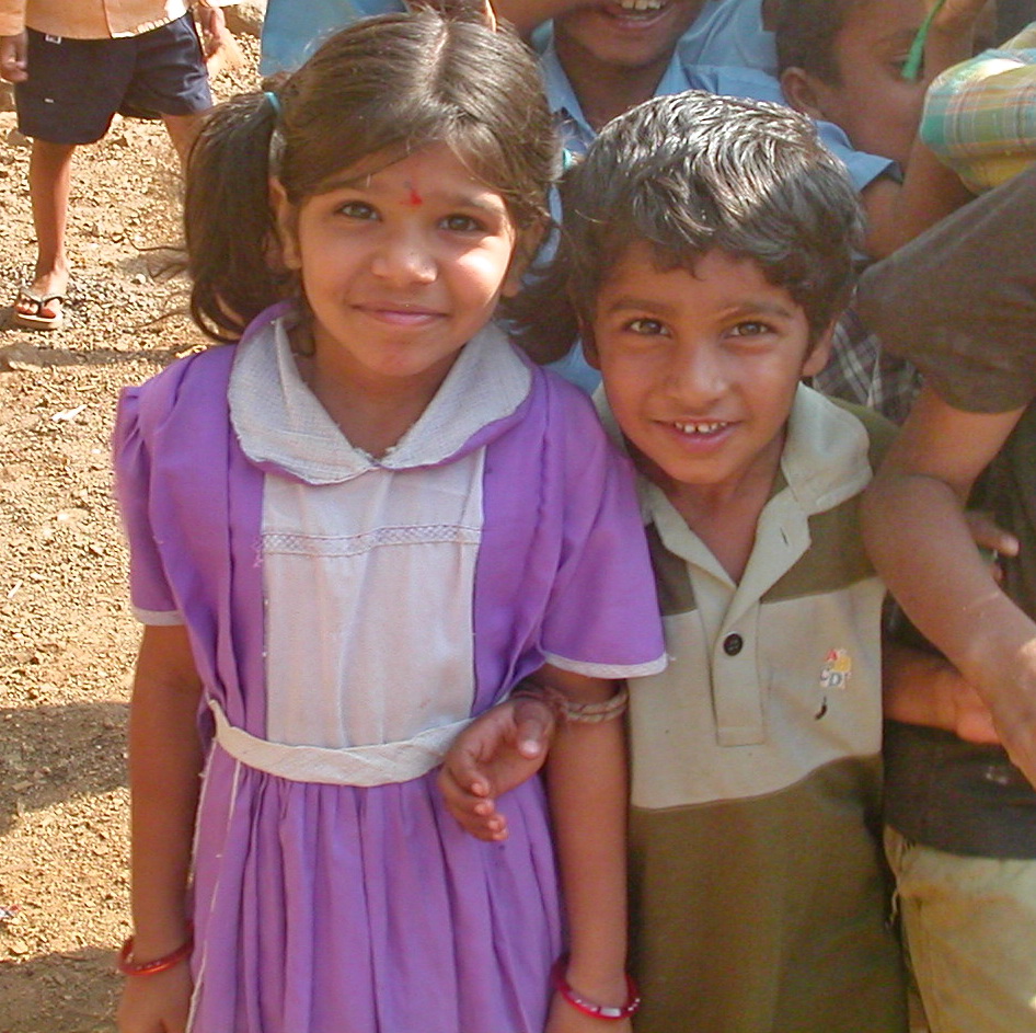 Young boy and girl smiling together.