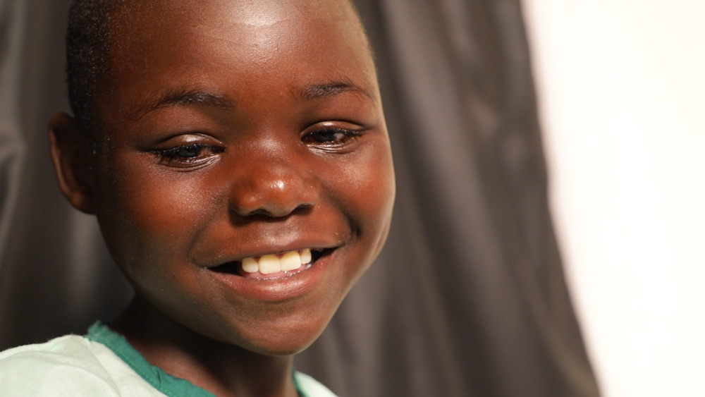 Abigael smiling|A child