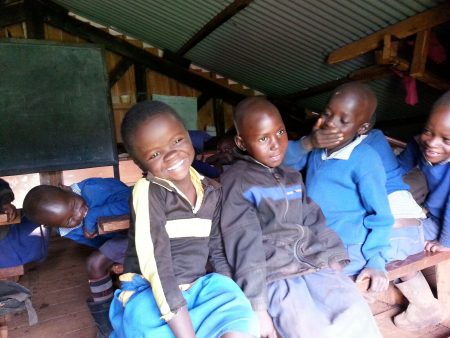 Happy Kenyan children with their sight restored|Kenayn child receives sight-saving eye care through Operation Eyesight|Children can see again through Operation Eyesight|Little boy has sight restored thanks to community eye health program through Operation Eyesight