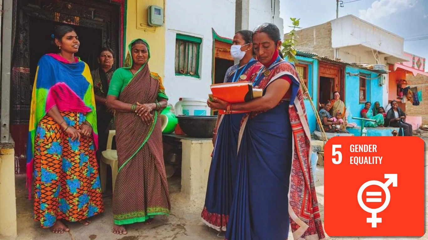 A group of women stand talking in the doorway of a home. Two of the women hold clipboards.|Community health workers provide eye health care and educations in communities.|||A group of women stand talking in the doorway of a home. Two of the women hold clipboards.||A group of women stand talking in the doorway of a home. Two of the women hold clipboards.