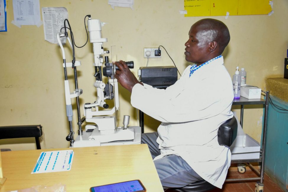 An optometrist works with a slip lamp|Portrait of Samson Keitany